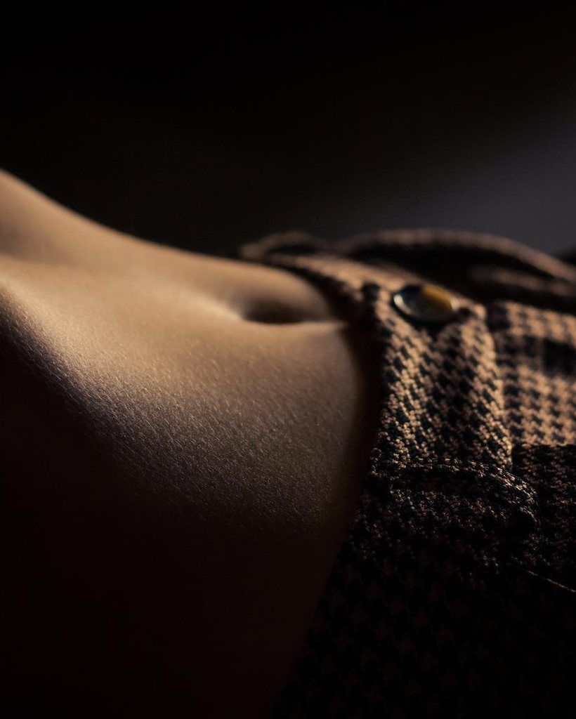 Close-up of houndstooth fabric against skin