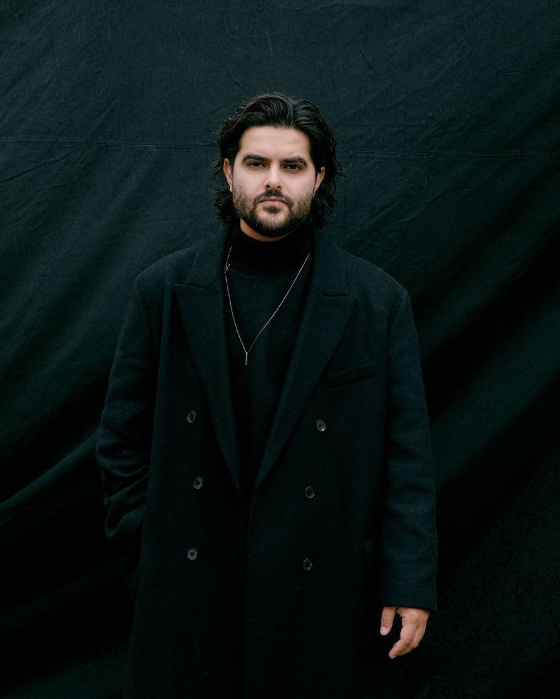 Artist in a black coat