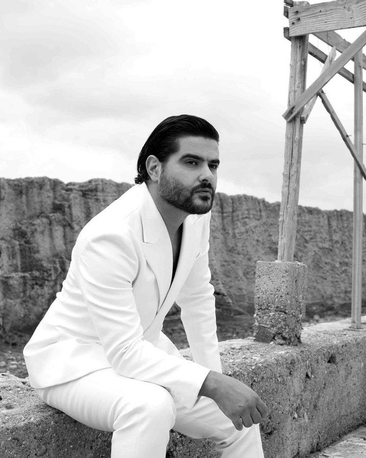 Artist in a white suit, black and white