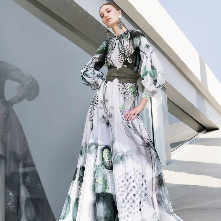 Model in a printed gown on a rooftop